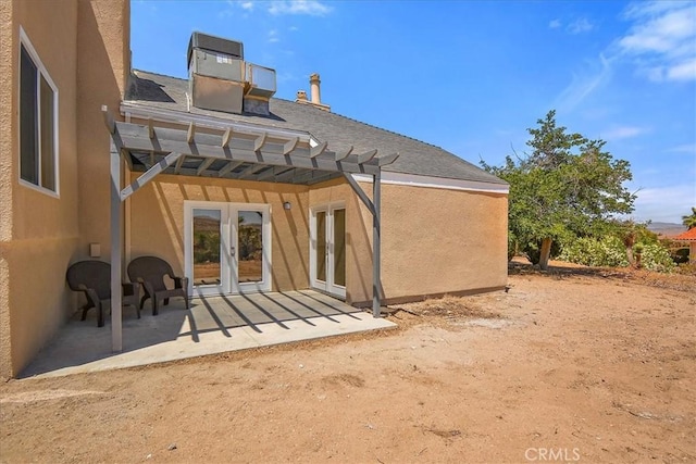 back of house featuring french doors, a pergola, and a patio