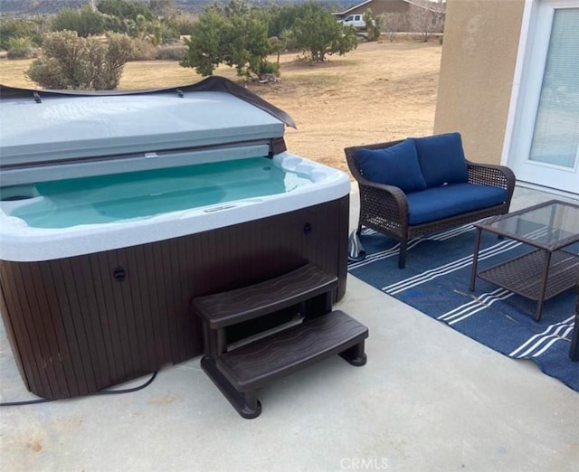 view of patio featuring a hot tub