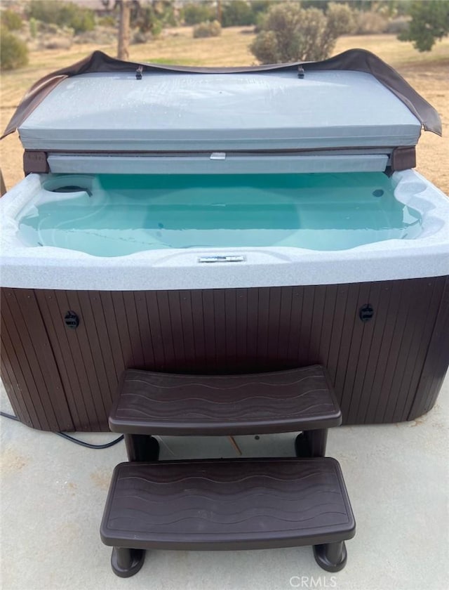 view of patio with a hot tub