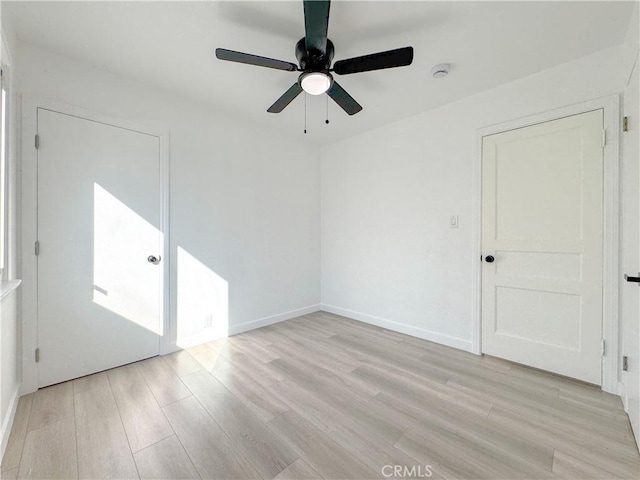 unfurnished room with light hardwood / wood-style floors and ceiling fan