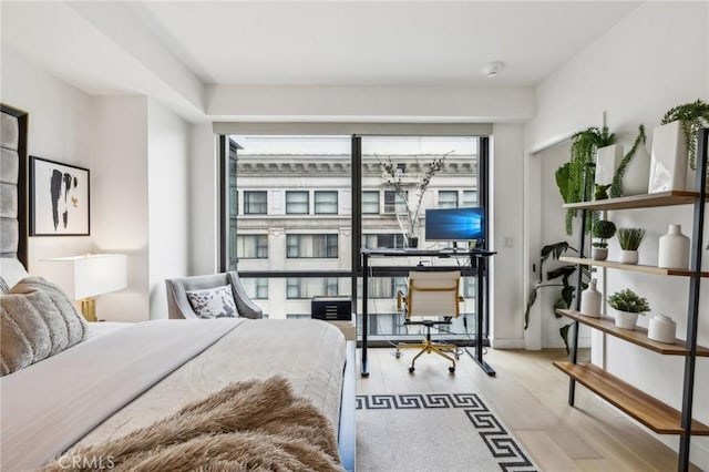 bedroom with light hardwood / wood-style flooring