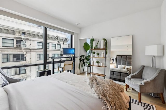 bedroom with hardwood / wood-style flooring