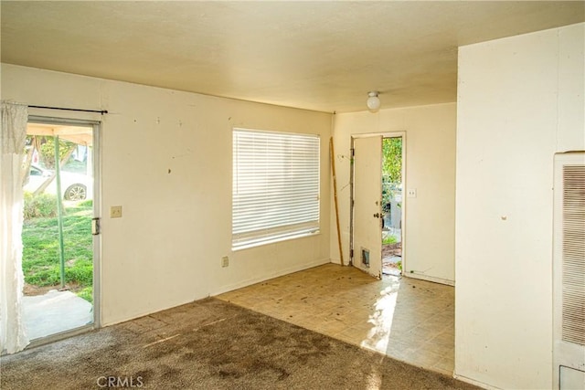 view of carpeted entrance foyer