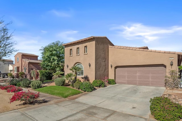 mediterranean / spanish-style home featuring a garage