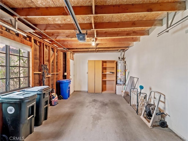 garage featuring a garage door opener and water heater