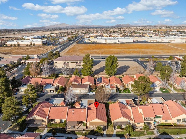 drone / aerial view featuring a mountain view