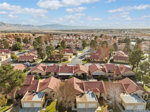 birds eye view of property with a mountain view