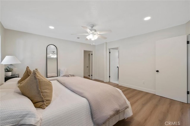 bedroom with ceiling fan and light wood-type flooring