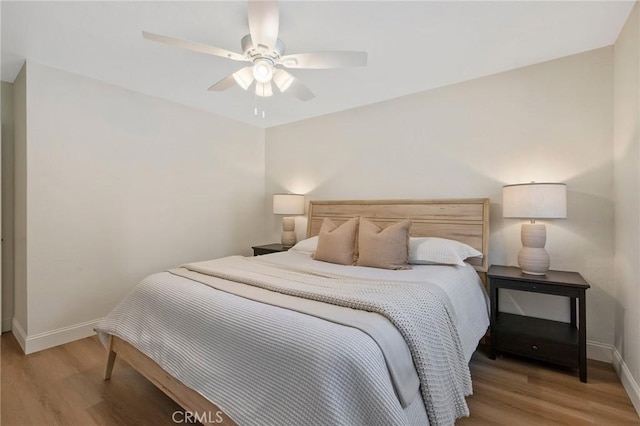 bedroom featuring hardwood / wood-style flooring and ceiling fan