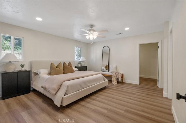 bedroom with wood-type flooring and ceiling fan