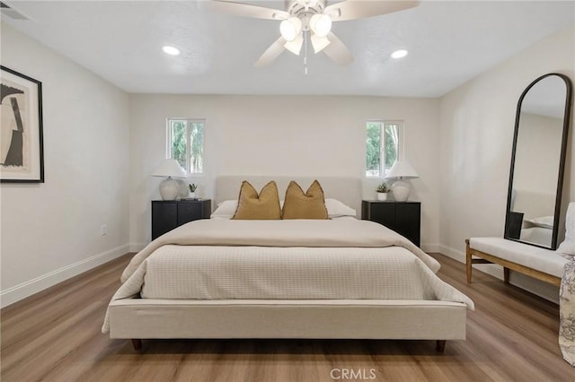 bedroom featuring hardwood / wood-style floors and ceiling fan