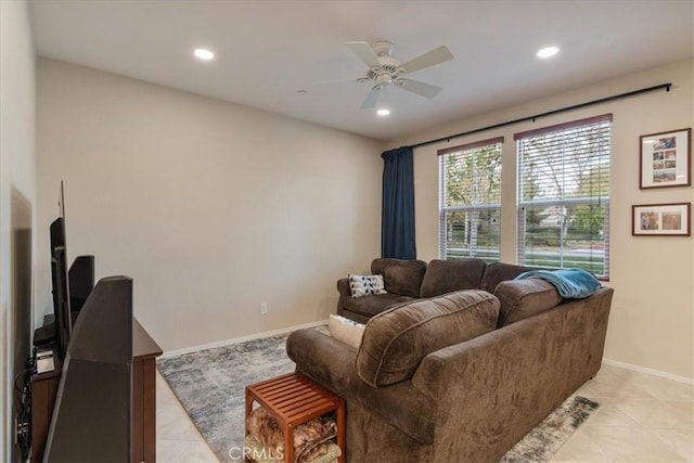 living room featuring ceiling fan and light tile patterned floors