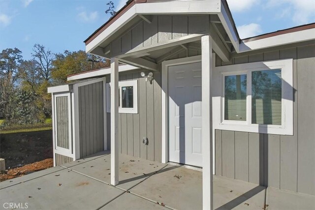 entrance to property with a patio area