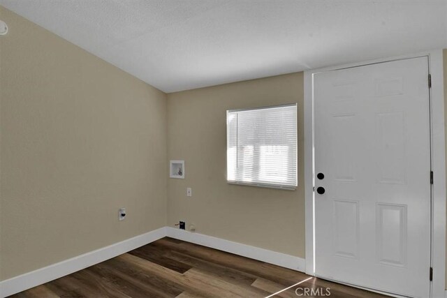 laundry room featuring washer hookup and hardwood / wood-style floors