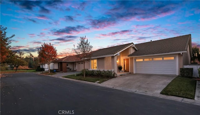 ranch-style house featuring a garage