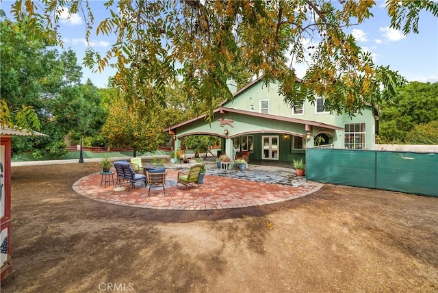 back of property with a patio