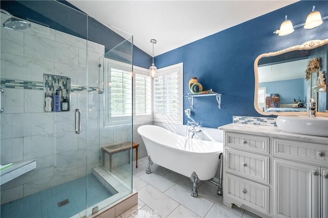 bathroom with vanity, vaulted ceiling, and independent shower and bath