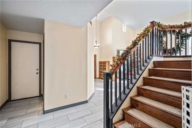 stairway with an inviting chandelier