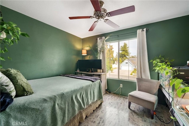 bedroom featuring ceiling fan and light hardwood / wood-style flooring