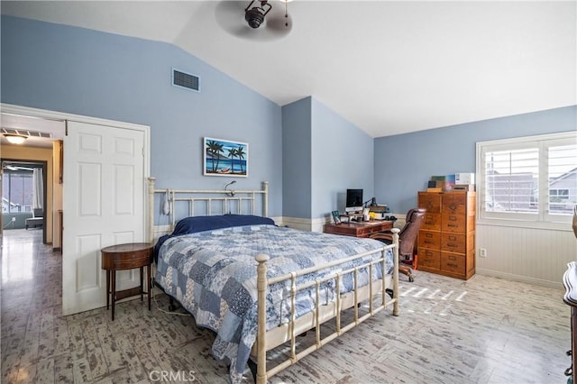 bedroom featuring hardwood / wood-style flooring and vaulted ceiling