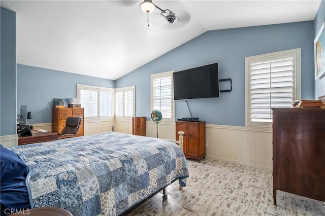 bedroom featuring ceiling fan and lofted ceiling