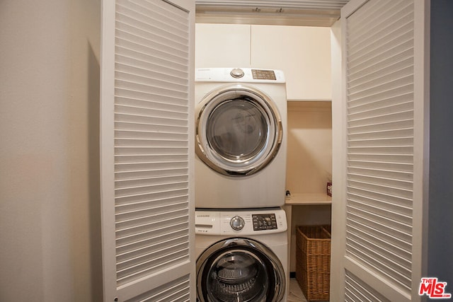 washroom with stacked washer and clothes dryer