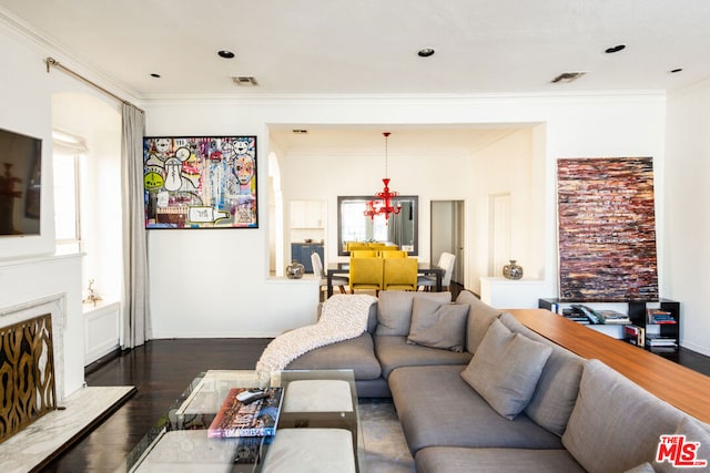 living room featuring a fireplace, dark hardwood / wood-style flooring, and ornamental molding