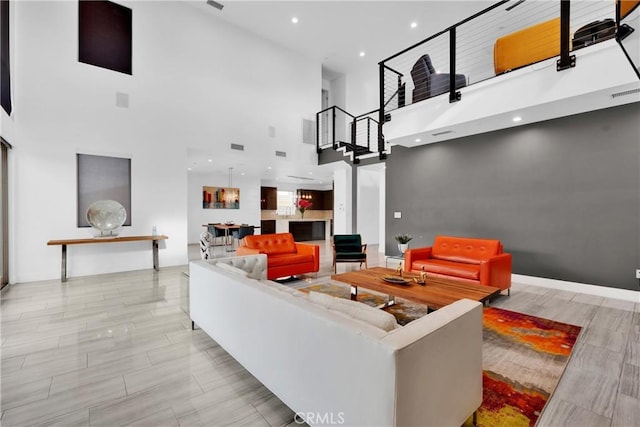 living room featuring a high ceiling