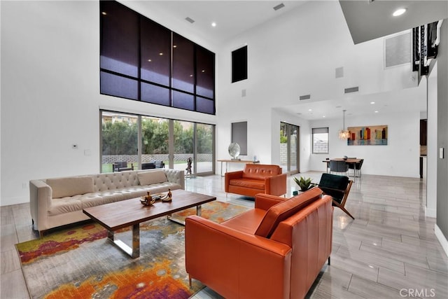 living room featuring a high ceiling