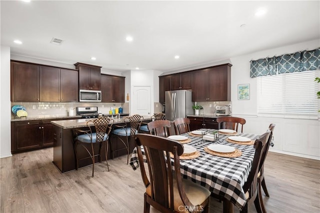 dining room featuring light hardwood / wood-style flooring