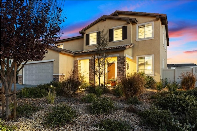 view of front of property with a garage