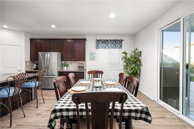 dining room with light wood-type flooring