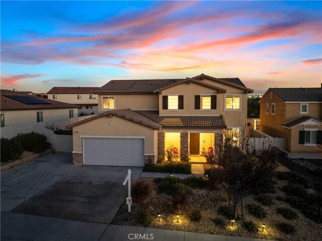 view of front of home with a garage