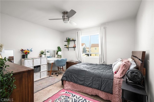 bedroom with ceiling fan and carpet flooring