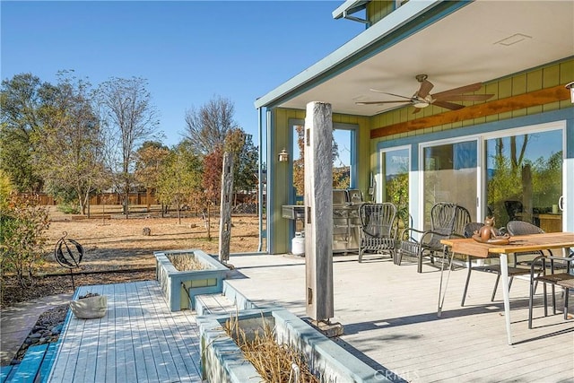 view of patio / terrace featuring a wooden deck and ceiling fan