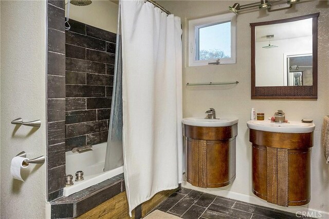 bathroom featuring vanity and shower / tub combo