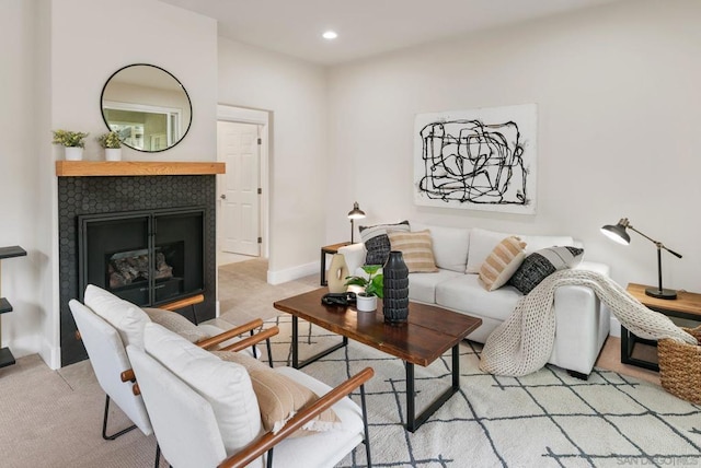 carpeted living room with a fireplace