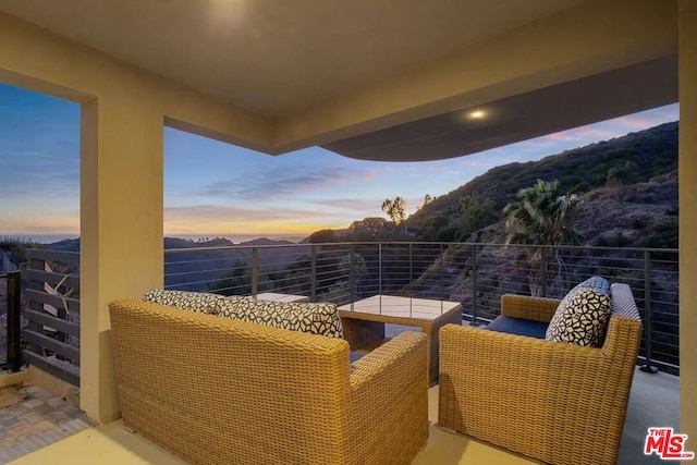 view of balcony at dusk