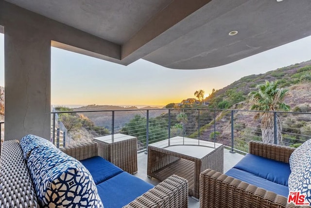 view of balcony at dusk