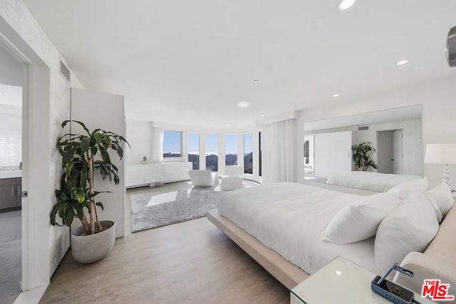 bedroom featuring hardwood / wood-style floors