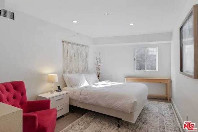 bedroom featuring light wood-type flooring