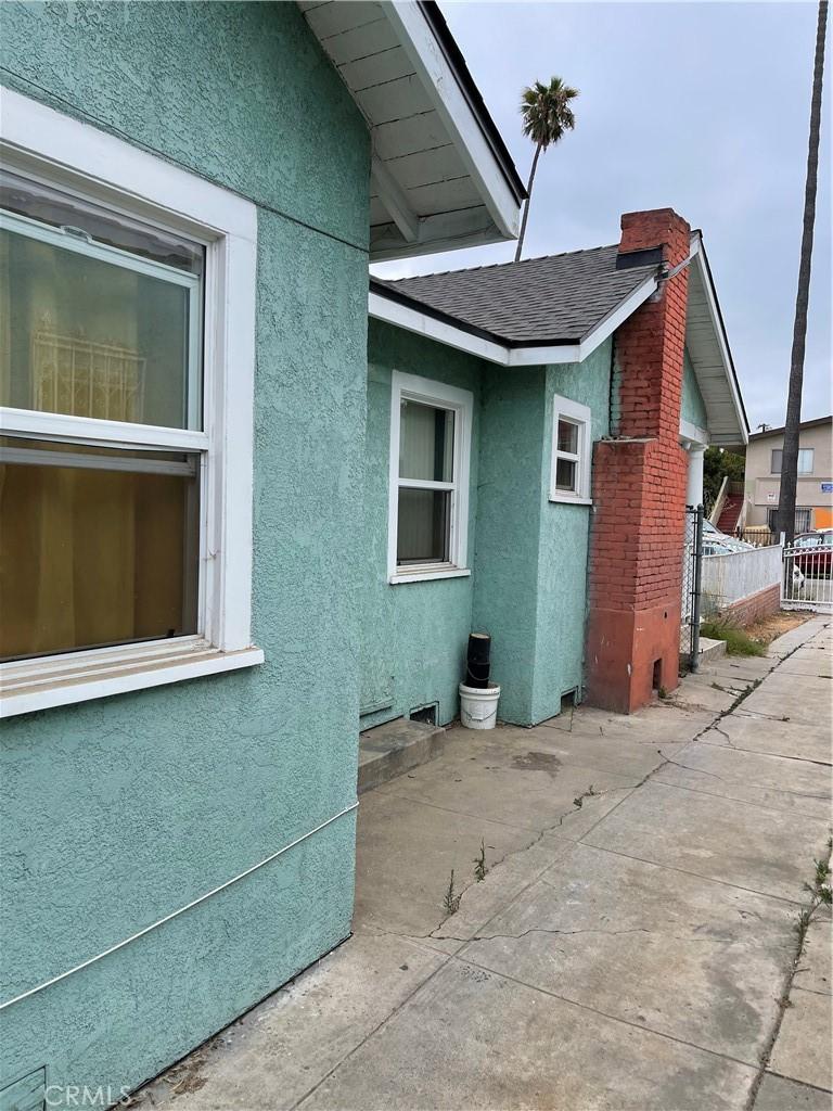 view of side of home with a patio