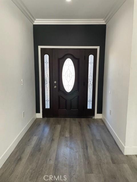 foyer featuring ornamental molding and hardwood / wood-style flooring