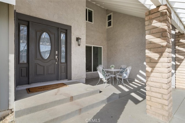 doorway to property with a porch