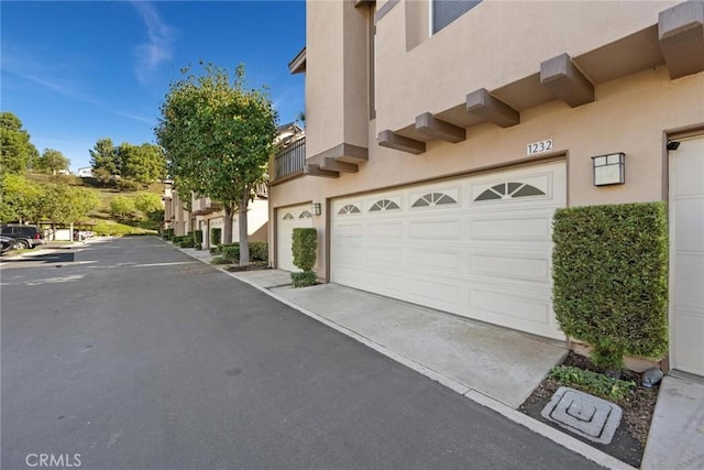 view of side of property featuring a garage