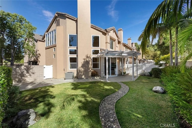 rear view of property with a lawn, a pergola, a patio, and central air condition unit