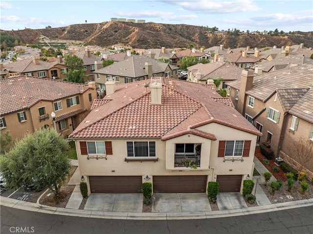 birds eye view of property featuring a mountain view