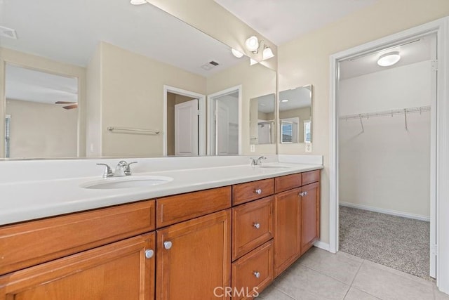 bathroom with tile patterned flooring and vanity