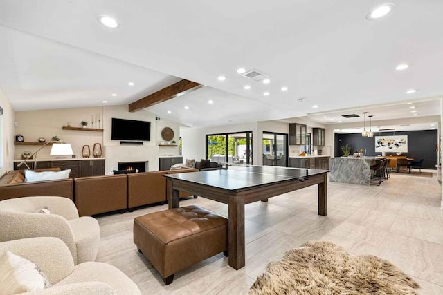 recreation room with lofted ceiling with beams