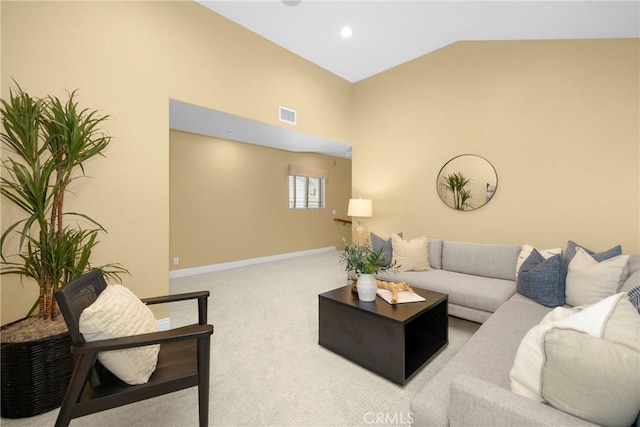 carpeted living room featuring lofted ceiling